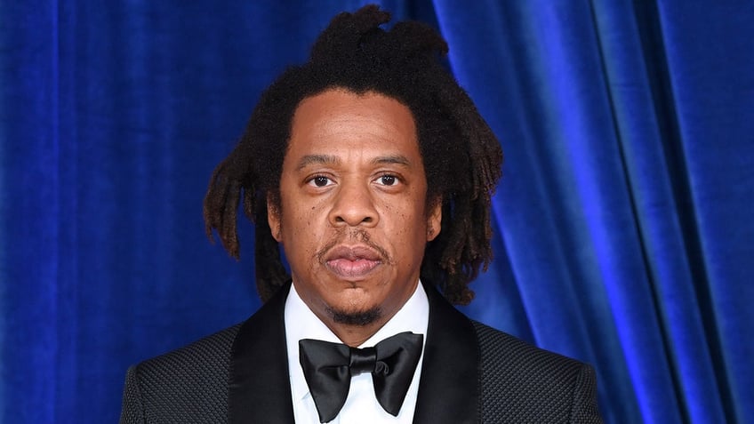 Jay-Z wears black suit at premiere in London