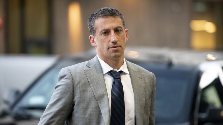 Lawyer Alex Spiro wears a grey suit in New York