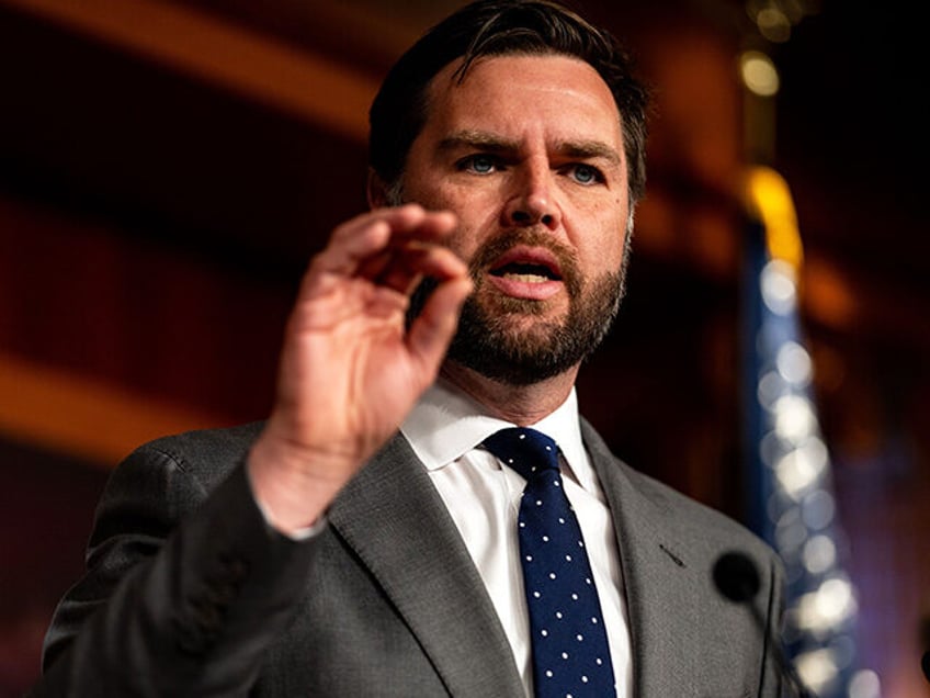 Sen. JD Vance (R-OH) gestures while speaking during a news conference on Capitol Hill on M