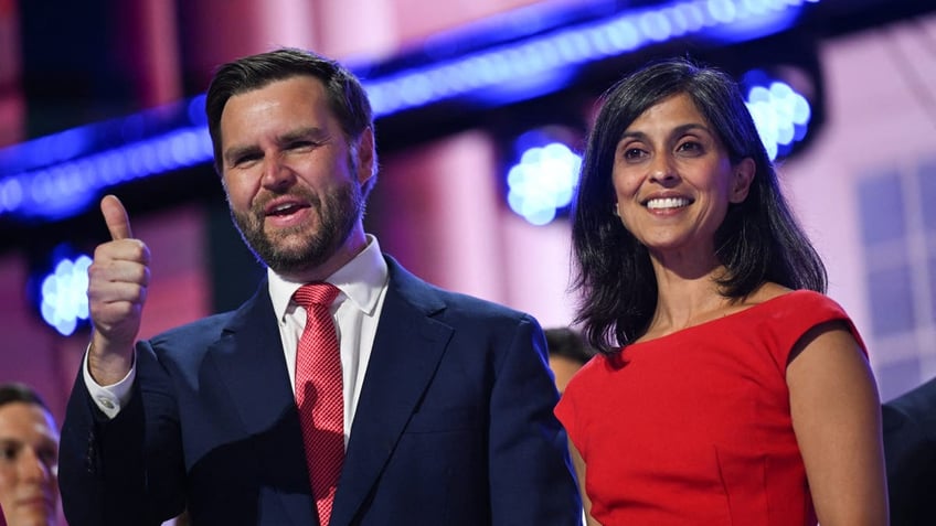 US Senator from Ohio and 2024 Republican vice presidential candidate J.D. Vance and his wife Usha Vance stand on stage on the last day of the 2024 Republican National Convention at the Fiserv Forum in Milwaukee, Wisconsin, on July 18, 2024. 