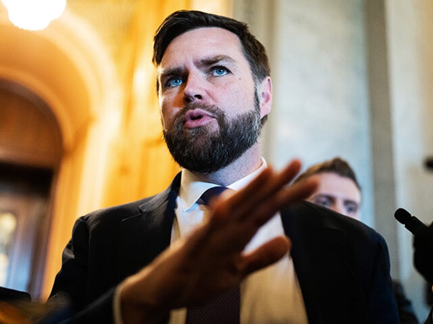 Sen. J.D. Vance, R-Ohio, talks with reporters after Speaker of the House Mike Johnson, R-L