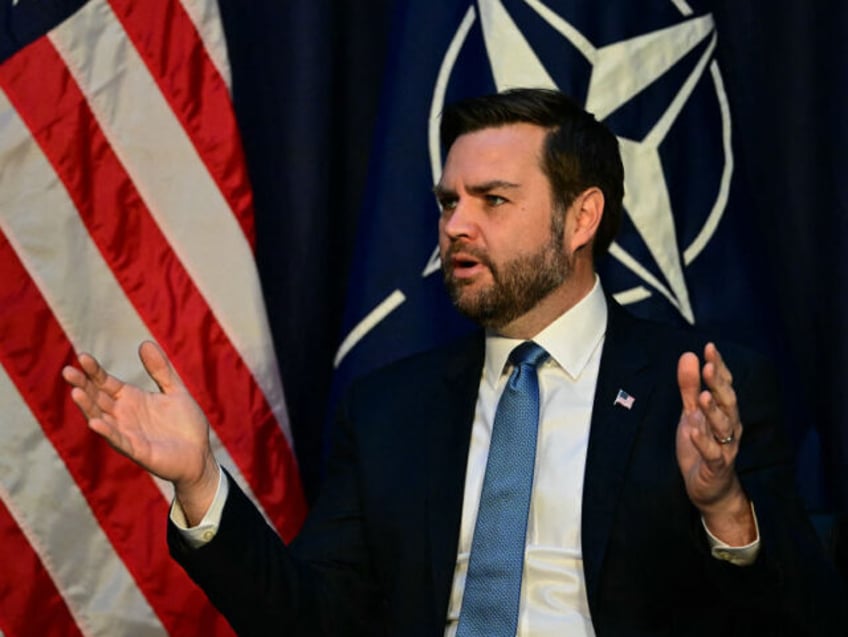 US Vice President JD Vance gestures as he speaks with NATO Secretary General during a meet