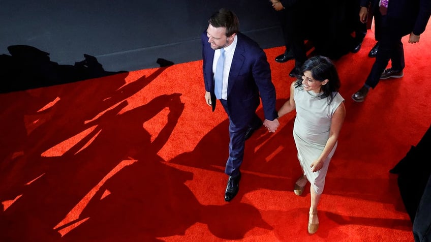 J. D. Vance and his wife Usha Vance arrive the first day of the 2024 Republican National Convention at the Fiserv Forum in Milwaukee, Wisconsin