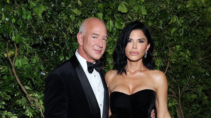 Jeff Bezos and Lauren Sanchez in a tux an dress