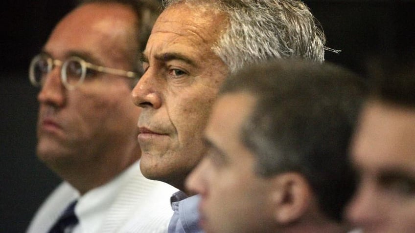 This July 30, 2008 photo shows Jeffrey Epstein in custody in West Palm Beach, Fla. Epstein was suspected nearly a decade ago of paying for sex with underage girls. The FBI abruptly dropped its investigation a few years ago, and Epstein pleaded guilty to a single state charge of soliciting prostitution. He served 13 months in jail. Now, two women who say they were sexually abused as girls by Epstein are hoping a trove of new documents will get the case reopened. (AP Photo/Palm Beach Post, Uma Sanghvi)