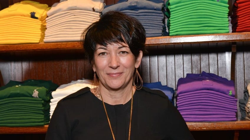 Ghislaine Maxwell wearing a black shirt standing in front of a Ralph Lauren clothing store shelf