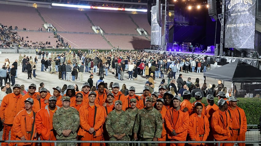 A group of first responders and incarcerated firefighters at Jelly Roll's concert