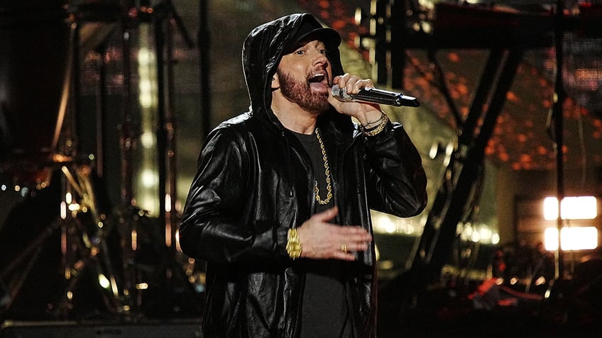 Eminem singing into microphone