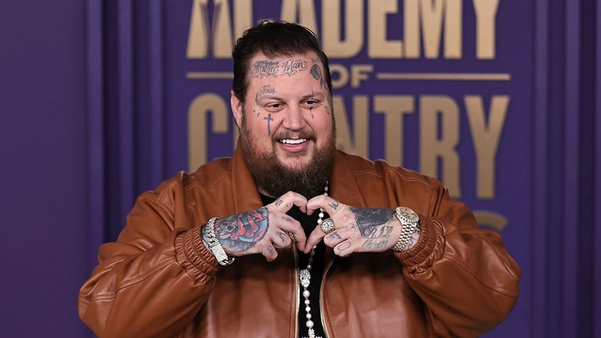 Jelly Roll smiling on the ACM red carpet