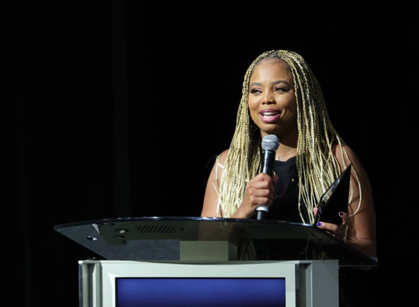 Sports journalist Jemele Hill accepts the William C. Rhoden Sports Media Award at the Advancement of Blacks in Sports Champions and Legends Awards at...