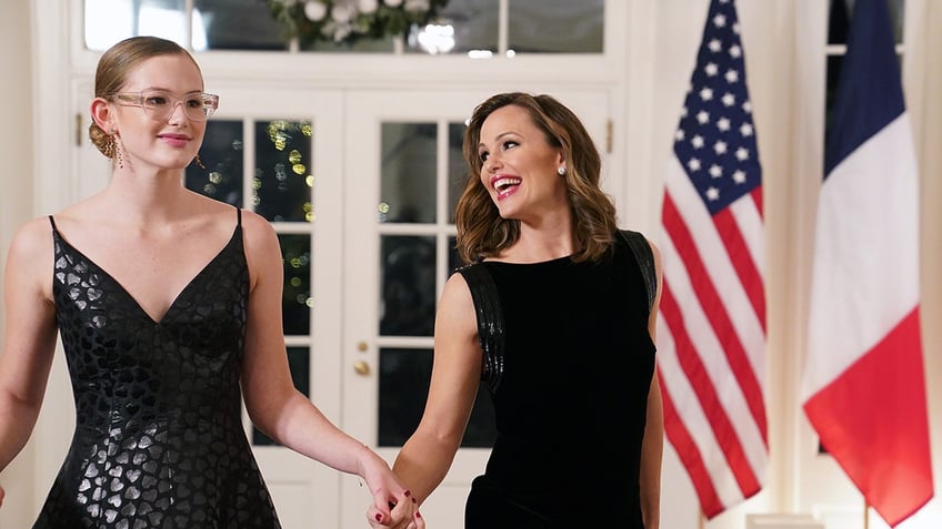 Jennifer Garner and Violet Affleck hold hands at the White House.