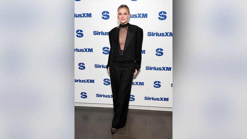 Ballerini wore a sheer top and trousers when visiting the SiriusXM studios.