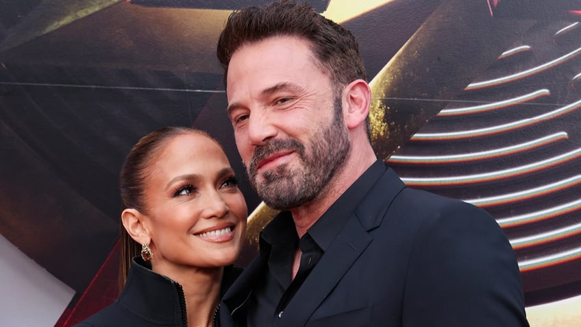 Jennifer Lopez and Ben Affleck smile on red carpet