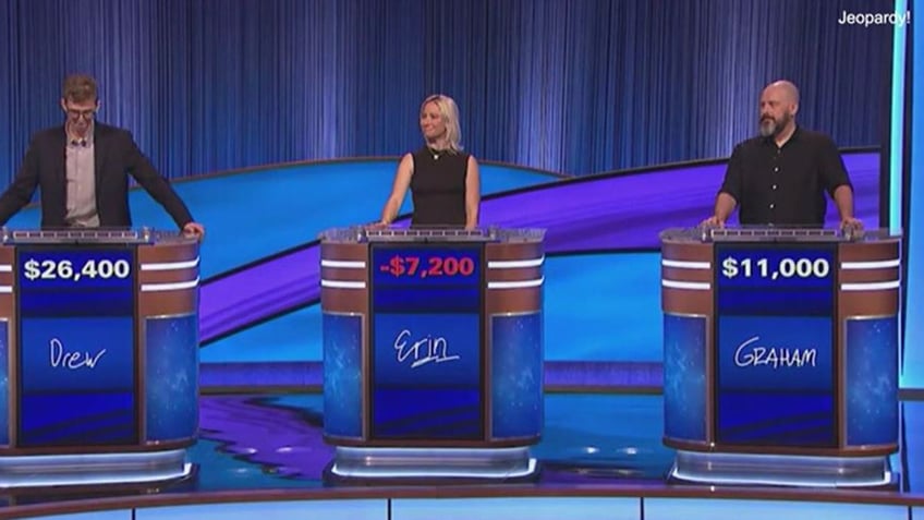 A photo from the ""Jeopardy!" stage with three contestants