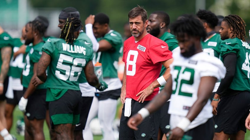 Aaron Rodgers participates in a drill during a Jets practice