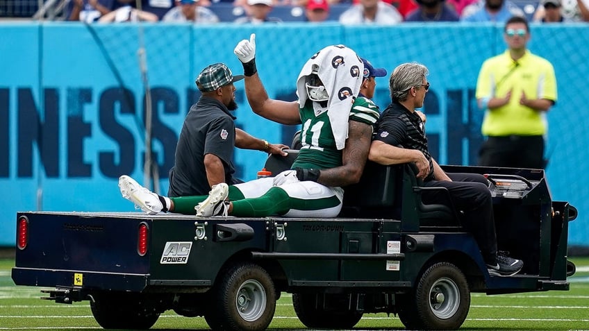 Jermaine Johnson carted off field