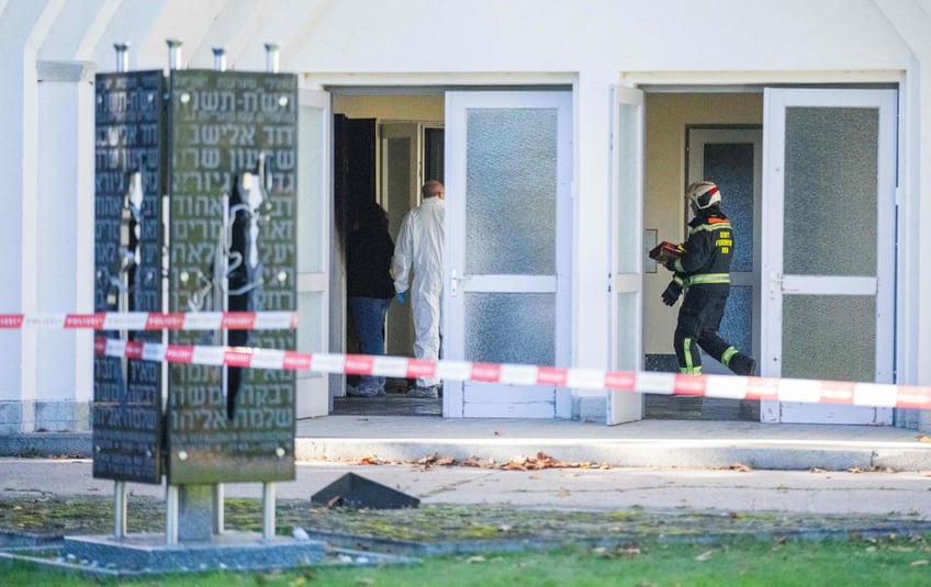 jewish cemetery set on fire and defaced with swastika and hitler graffiti in austria