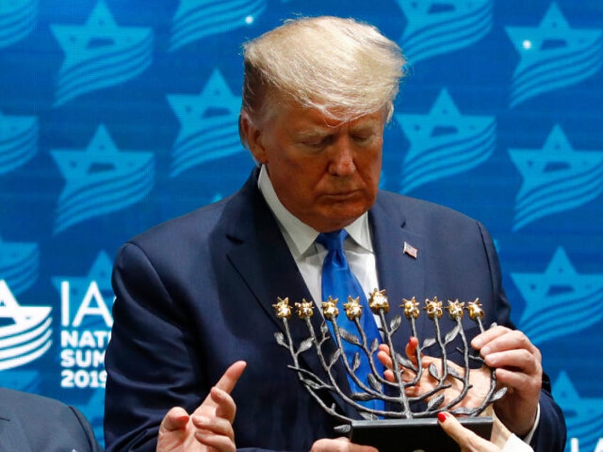 President Donald Trump receives a menorah from Las Vegas Sands Corporation Chief Executive