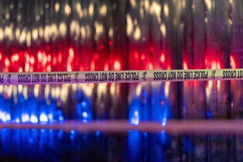 Police tape is seen outside the Capital Jewish Museum following a shooting that left two p