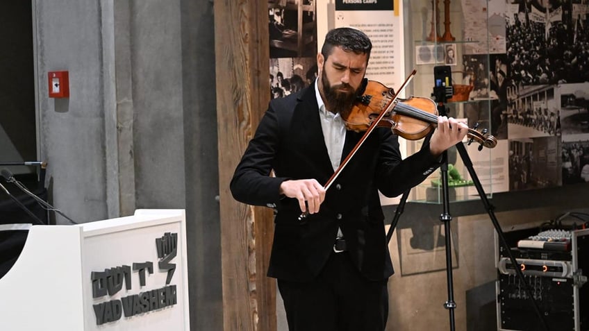 Yad Vashem playing violin