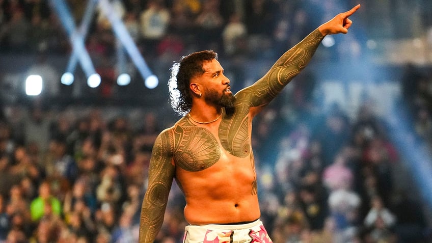 Jey Uso points to the WrestleMania sign