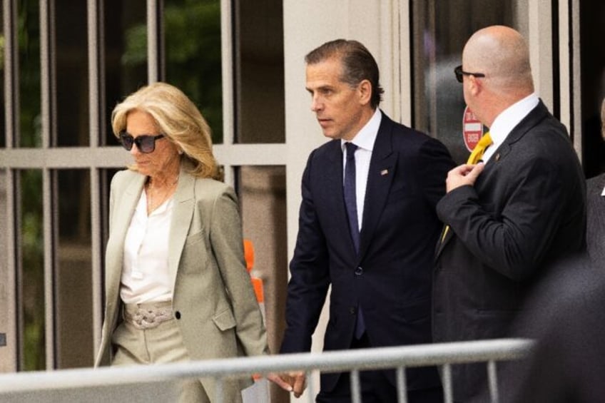 Hunter Biden, joined by his mother US First Lady Jill Biden, exits the J. Caleb Boggs Fede