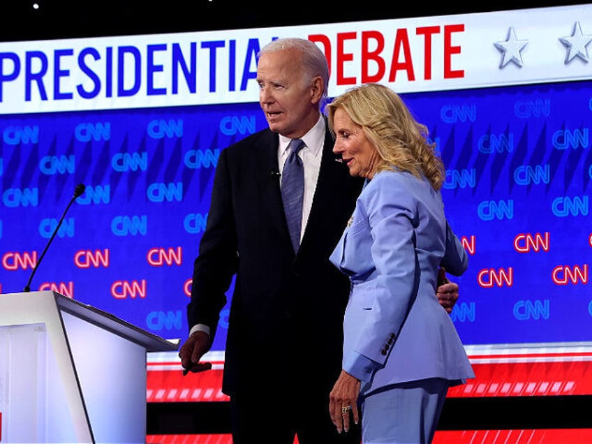 ATLANTA, GEORGIA - JUNE 27: U.S. President Joe Biden walks off with first lady Jill Biden