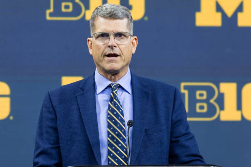 jim harbaugh to receive self imposed suspension from michigan