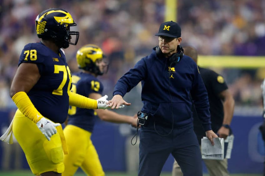 jim harbaugh to receive self imposed suspension from michigan