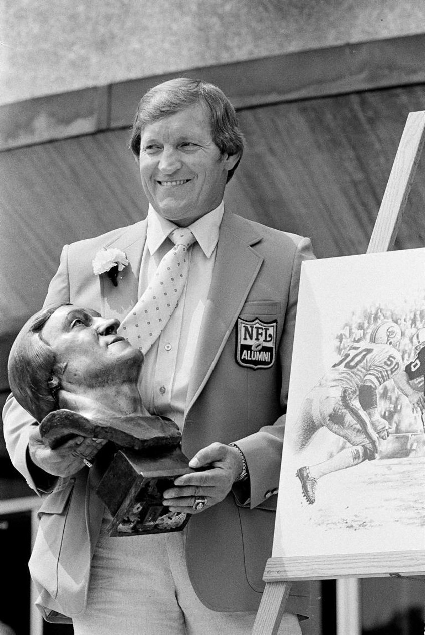 Jim Otto, former center for the Oakland Raiders, poses with his bust after enshrinement in the Pro Football Hall of Fame in Canton, Ohio, Aug. 2, 1980. Otto, the Hall of Fame center known as “Mr. Raider” for his durability through a litany of injuries, has died, the team confirmed Sunday night, May 19, 2024. He was 86. (AP Photo, File)