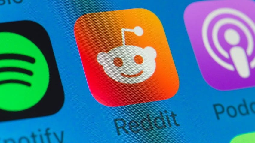 The Reddit app logo on a blue background.