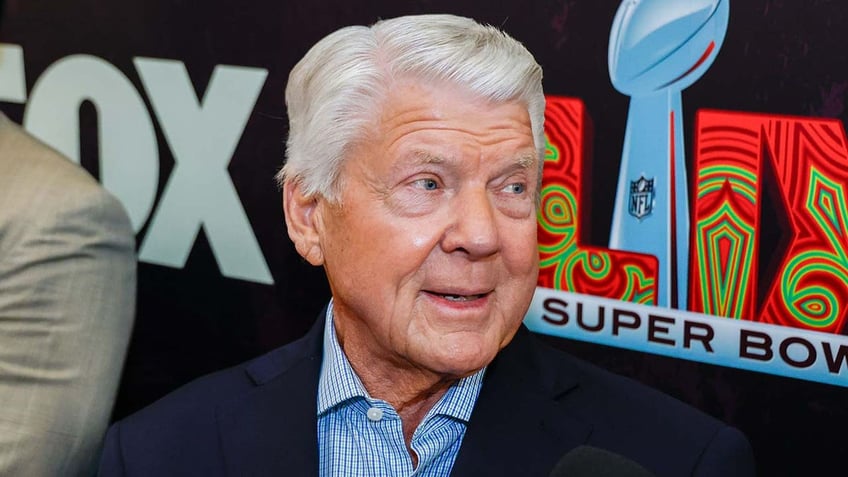 Jimmy Johnson talks to reporters