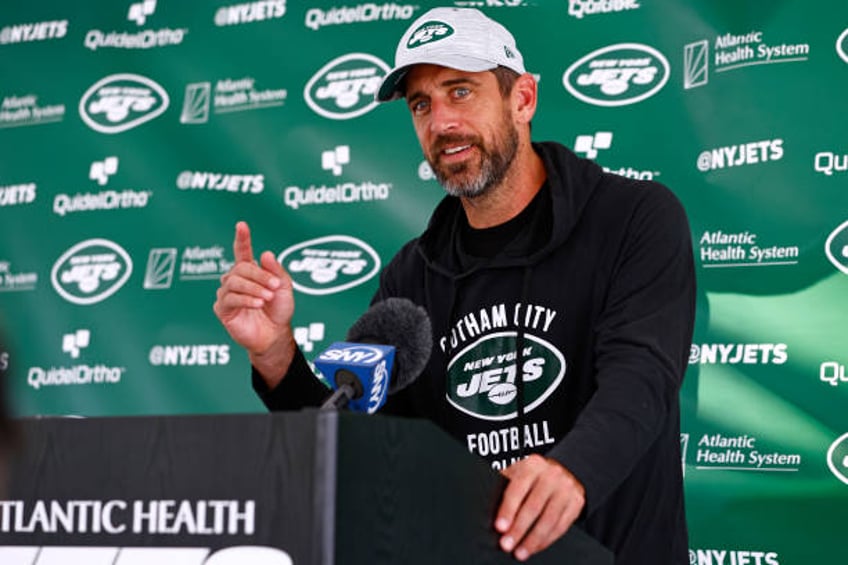 Quarterback Aaron Rodgers of the New York Jets talks to reporters after training camp at Atlantic Health Jets Training Center on July 26, 2023 in...