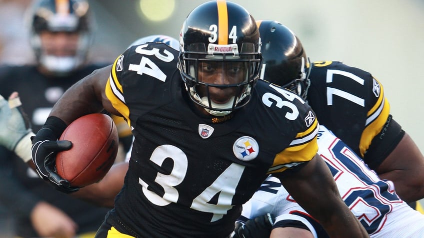 Rashard Mendenhall runs