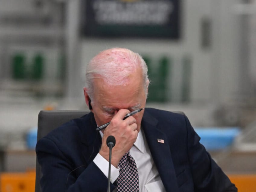 US President Joe Biden reacts while attending the Lobito Corridor Trans-Africa Summit at t