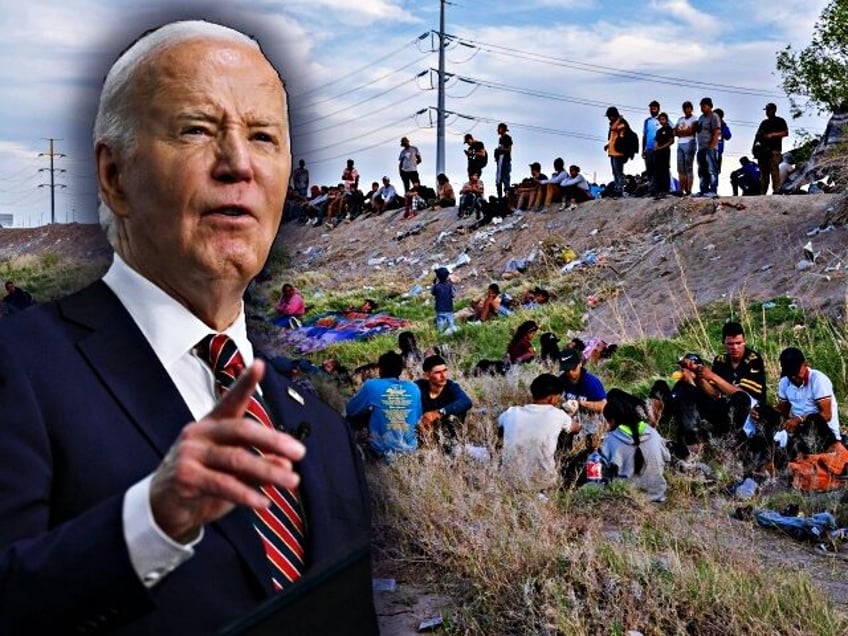 Migrants rest on the bank of the dry river bed of the Rio Grande at the US-Mexico border i