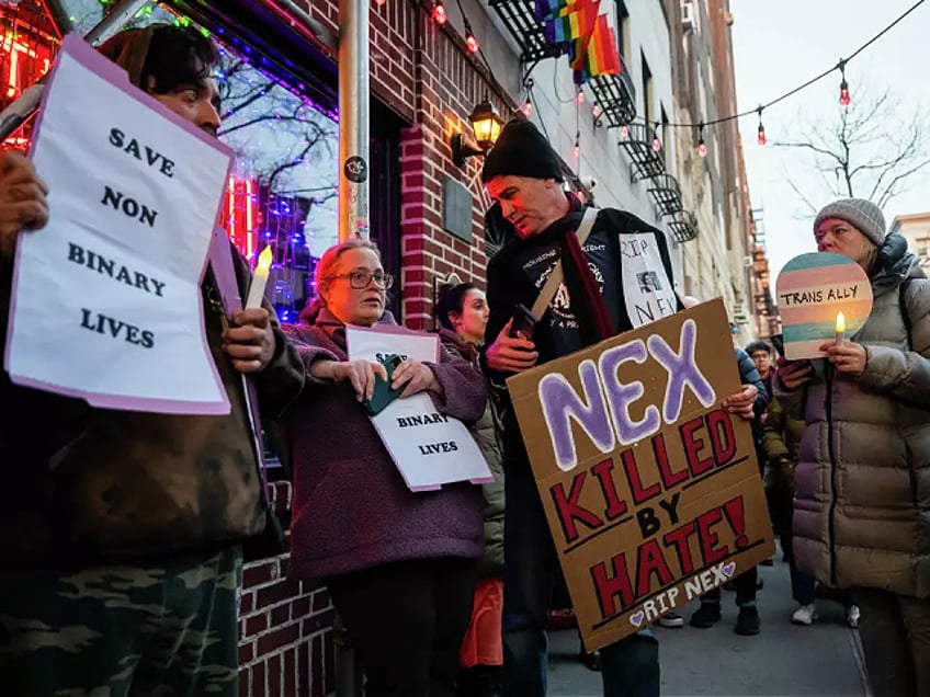 NEW YORK, NEW YORK - FEBRUARY 26: People gather outside the Stonewall Inn for a memorial and vigil for the Oklahoma teenager who died following a fight in a high school bathroom on February 26, 2024 in New York City. Nex Benedict, a 16-year-old who identified as nonbinary and used they/them pronouns, died a day after the altercation in the school bathroom. Benedict, who had complained before about bullying at school, is being remembered across the country and world. (Photo by Spencer Platt/Getty Images)