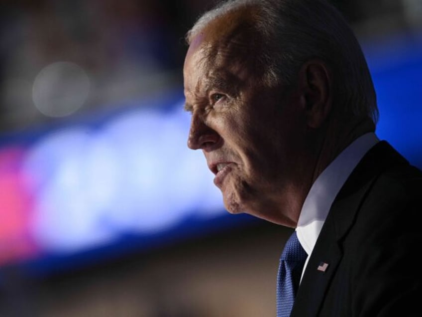 US President Joe Biden speaks on stage on the first day of the Democratic National Convent