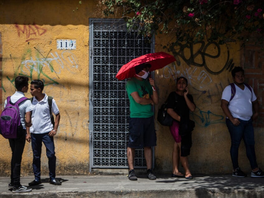 A man uses a face mask as a precautionary measure against the spread of the new coronaviru