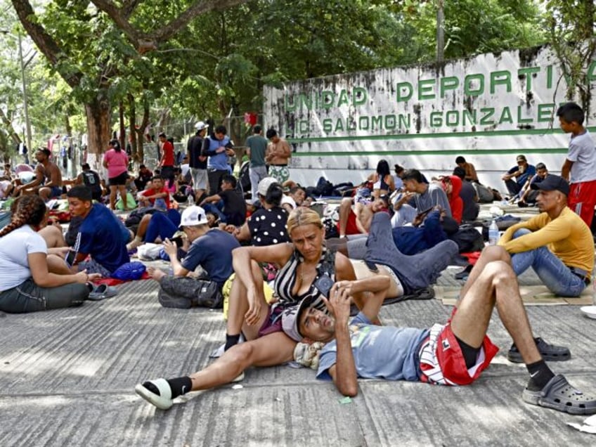 ESCUINTLA, MEXICO-DECEMBER 4: Migrants rest before resuming their walk en route to the Uni