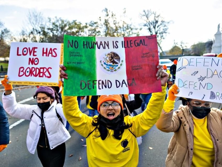 WASHINGTON, DC, UNITED STATES- NOVEMBER 17: Pro-DACA protestors hold a march outside of th