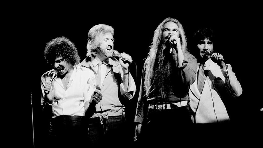 Black and white photo of The Oak Ridge Boys performing