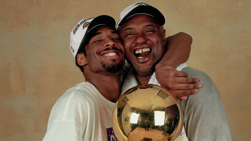 Kobe Bryant hugs his dad Joe Bryant