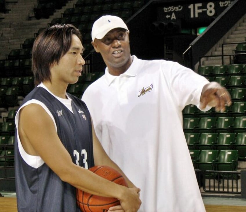 Former NBA player Joe Bryant, right, has died at age 69. The father of the late NBA supers