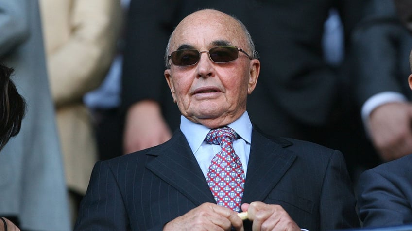 joe lewis premier league team owner charged with insider trading