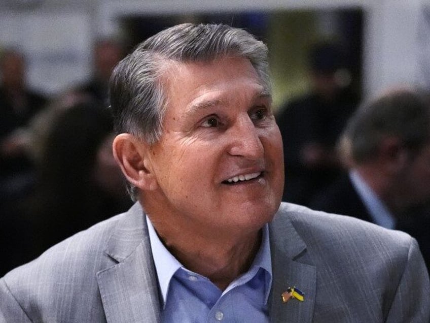 Sen. Joe Manchin, D-W.Va., smiles while being introduced during the 'Politics and Egg