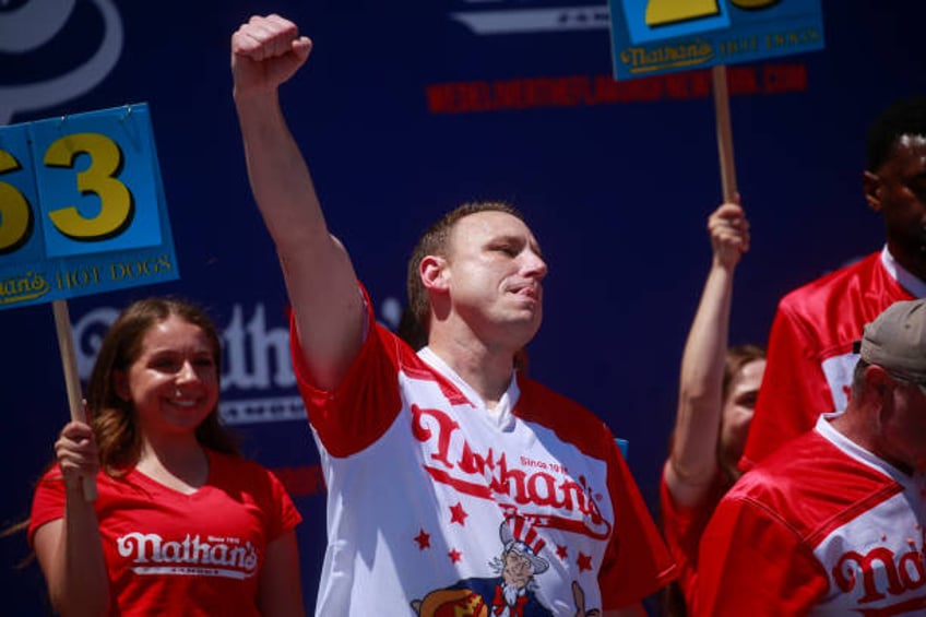 Joey Chestnut reacts after winning first place, eating 63 hot dogs in 10 minutes, during the 2022 Nathans Famous Fourth of July International Hot Dog...