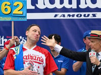 Joey Chestnut shows no rust as he downs 57 hot dogs in competition at Fort Bliss