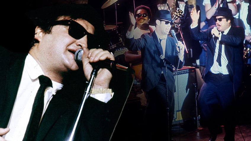 Blues Brothers stars John Belushi and Dan Aykroyd perform during concert.