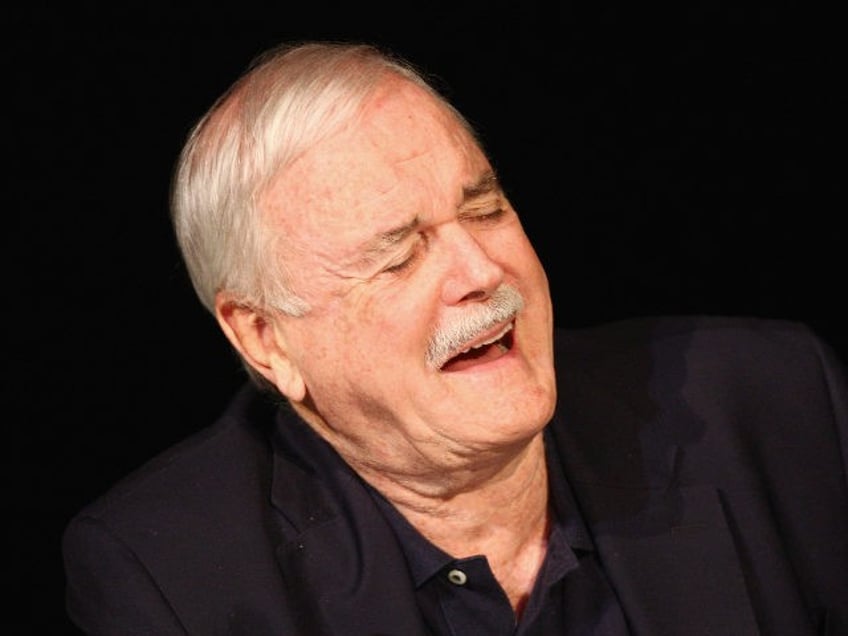 LONDON, ENGLAND - JUNE 30: John Cleese laughs as he attends a press conference ahead of their upcoming tour at the O2 Arena Monty Python Live at the London Palladium on June 30, 2014 in London, England. (Photo by Dave Hogan/Getty Images)